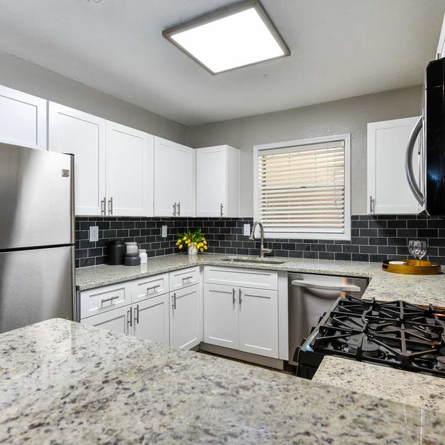 The Preserve at Dunwoody - Kitchen With Modern Appliances and Granite Countertops
